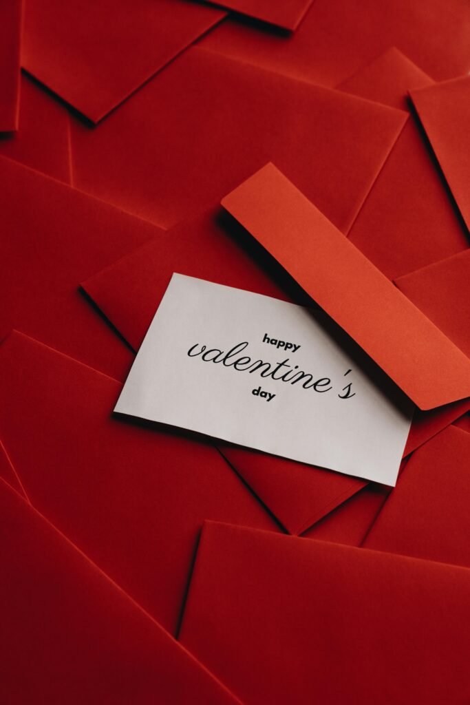 Extra Special Valentine's Day Gifts. Red envelopes with a card saying 'Happy Valentine's Day'. Perfect for romantic occasions.